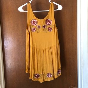 Summer time yellow romper with floral stitching